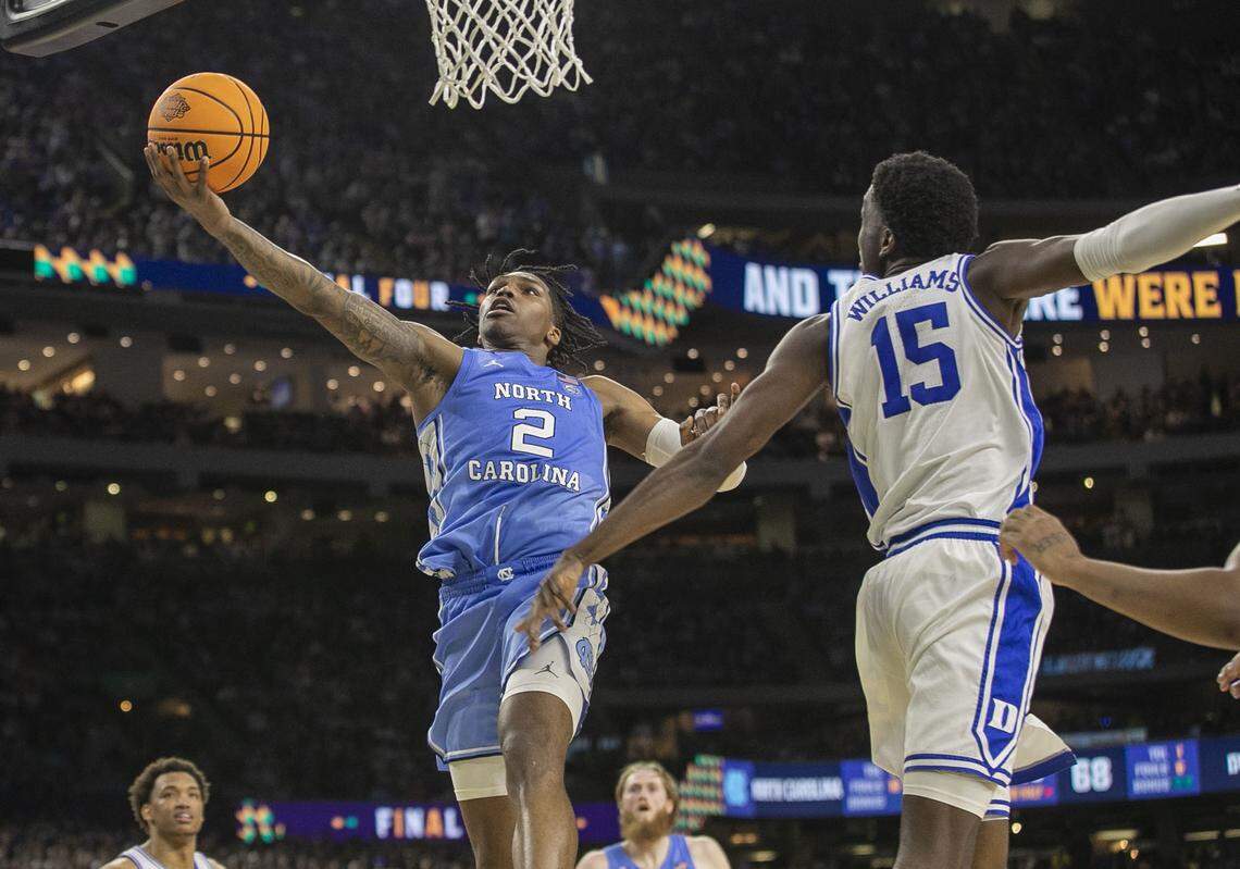 North Carolina’s Caleb Love (2) drives to the basket past Duke’s Mark Williams (15) for two of his game high 28 points, leading the Tar Heels to an 81-77 victory over Duke during the NCAA Final Four semi-final on Saturday, April 2, 2022 at Caesars Superdome in New Orleans, La.