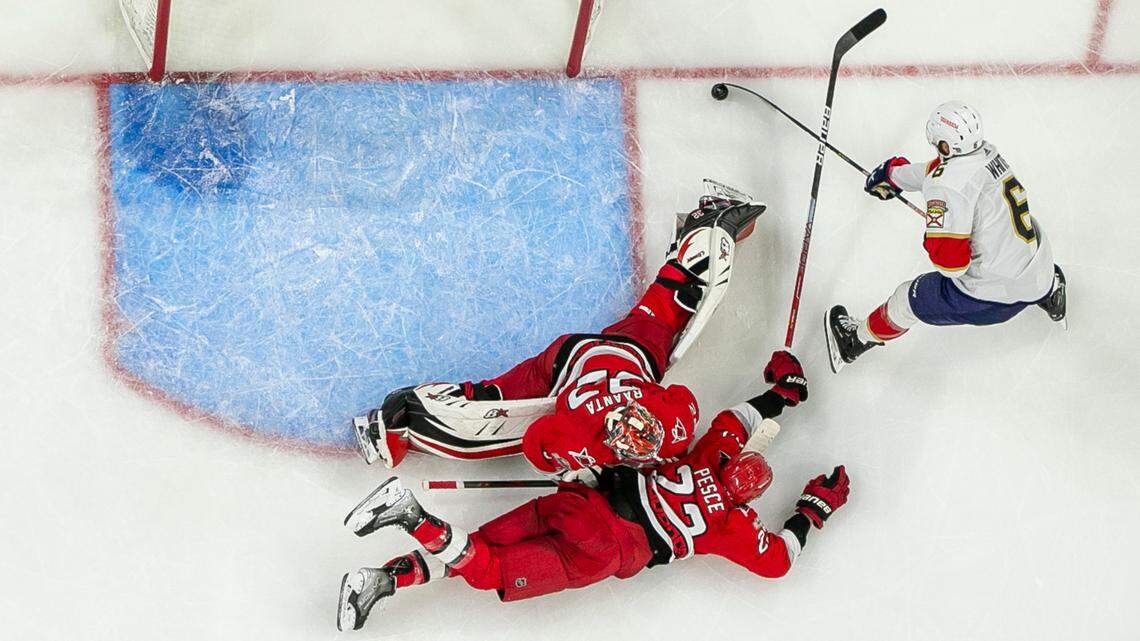 The Florida Panthers Colin White (6) works against Carolina Hurricanes goalie Antii Raanta (32) and Brett Pesce (22) in the third period during Game 2 of the Eastern Conference Finals on Saturday, May 20, 2023 at PNC Arena in Raleigh, N.C.