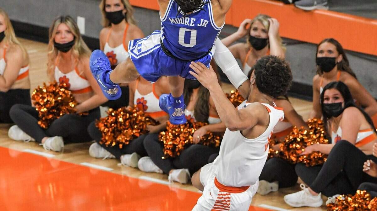 Clemson guard David Collins (13) fouls Duke forward Wendell Moore Jr (0) during the first half of an NCAA college basketball game in Clemson, S.C., Thursday, Feb. 10, 2022. Collins was ejected. Duke beat Clemson 82-64. (Ken Ruinard/The Independent-Mail via AP)