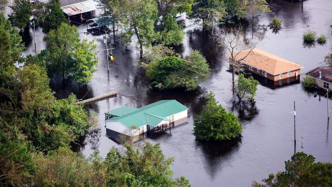 In this 2018 file photo, flood water surrounds buildings in Trenton, N.C. three days after Hurricane Florence made landfall in Wilmington in Sept. 2018.