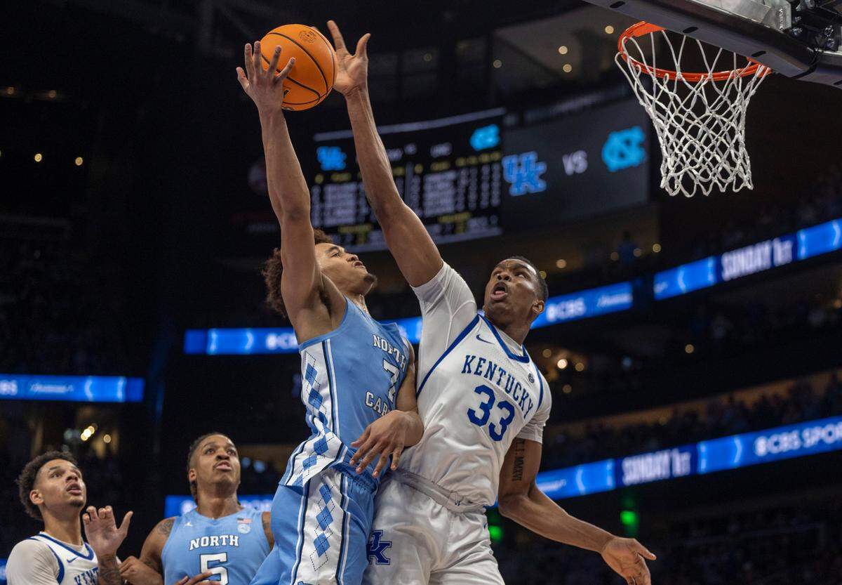 Kentucky’s Ugonna Onyenso (33) blocks a shot by North Carolina’s Seth Trimble (7) in the second half on Saturday, December 16, 2023 at State Farm Arena in Atlanta, Georgia.