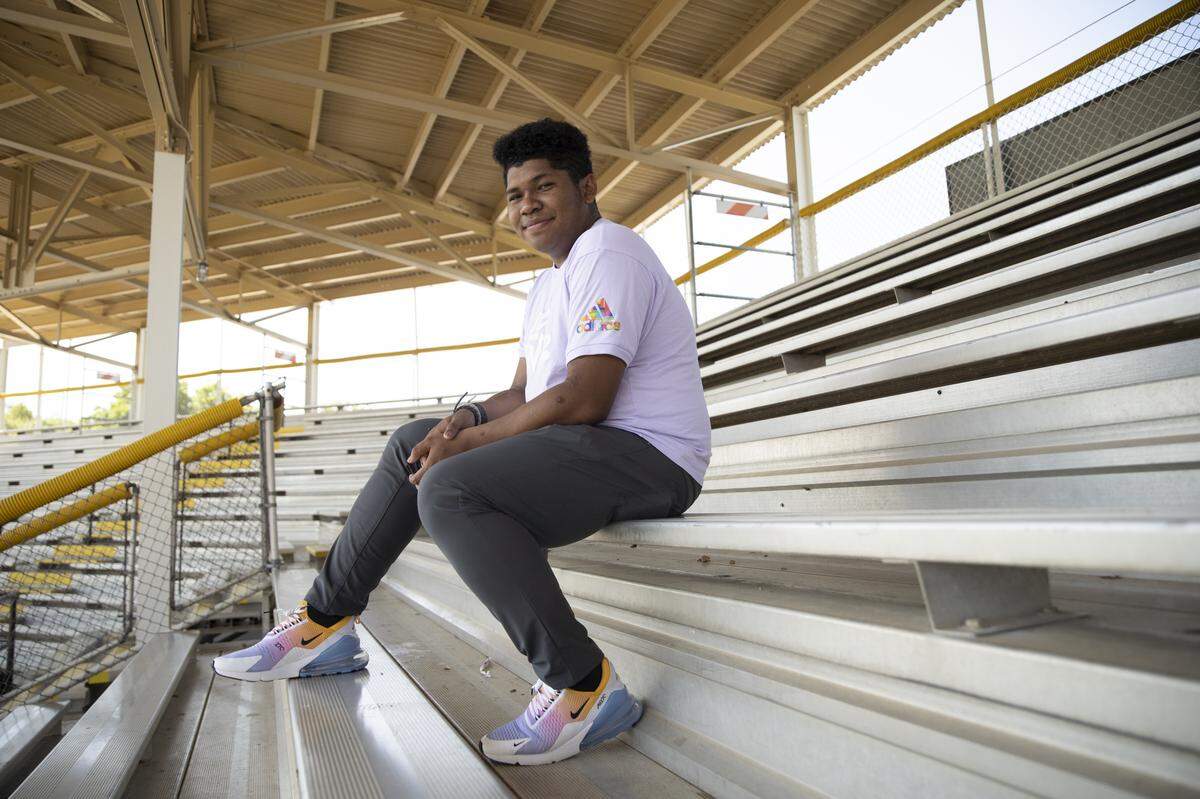 Ethan Gabriel, promotions and entertainment intern at the Burlington Sock Puppets, poses for a portrait on June 28, 2021, in Burlington, N.C. Gabriel is helping to launch the Burlington Athletic Stadiums’ first Pride Night event.