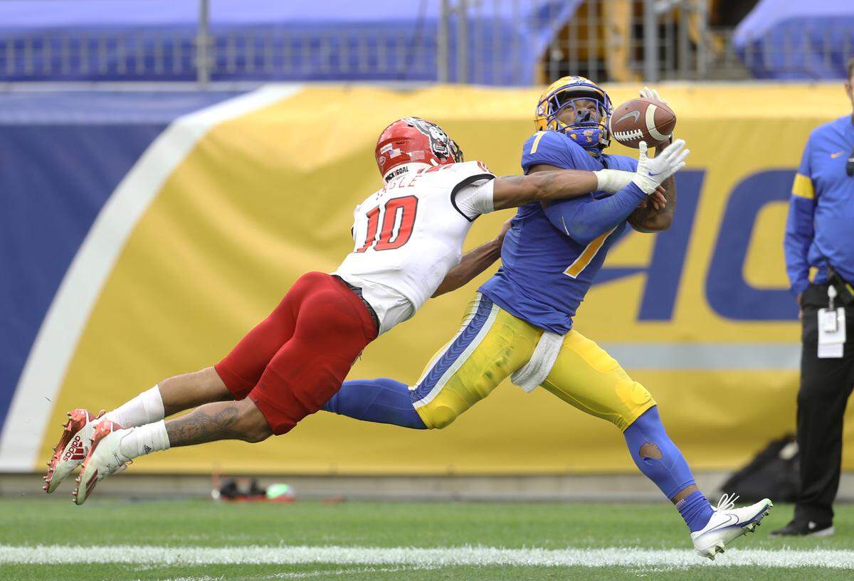 N.C. State’s Tanner Ingle (10) breaks up a pass intended for Pittsburgh Panthers wide receiver DJ Turner (7) during the Wolfpack’s game against the Panthers at Heinz Field in Pittsburgh, PA, Saturday, Oct. 3, 2020.