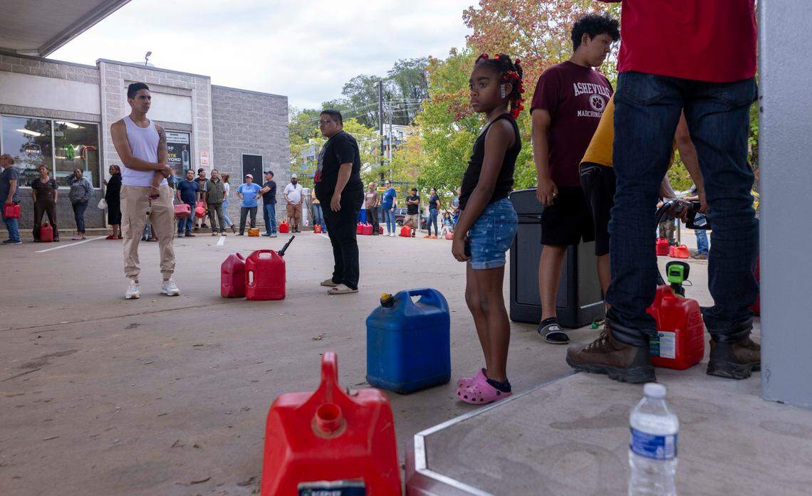 Asheville residents residents line up for gasoline at a gas station on Sunday, Sept. 29, 2024. The remnants of Hurricane Helene caused widespread flooding, downed trees, and power outages in western North Carolina.