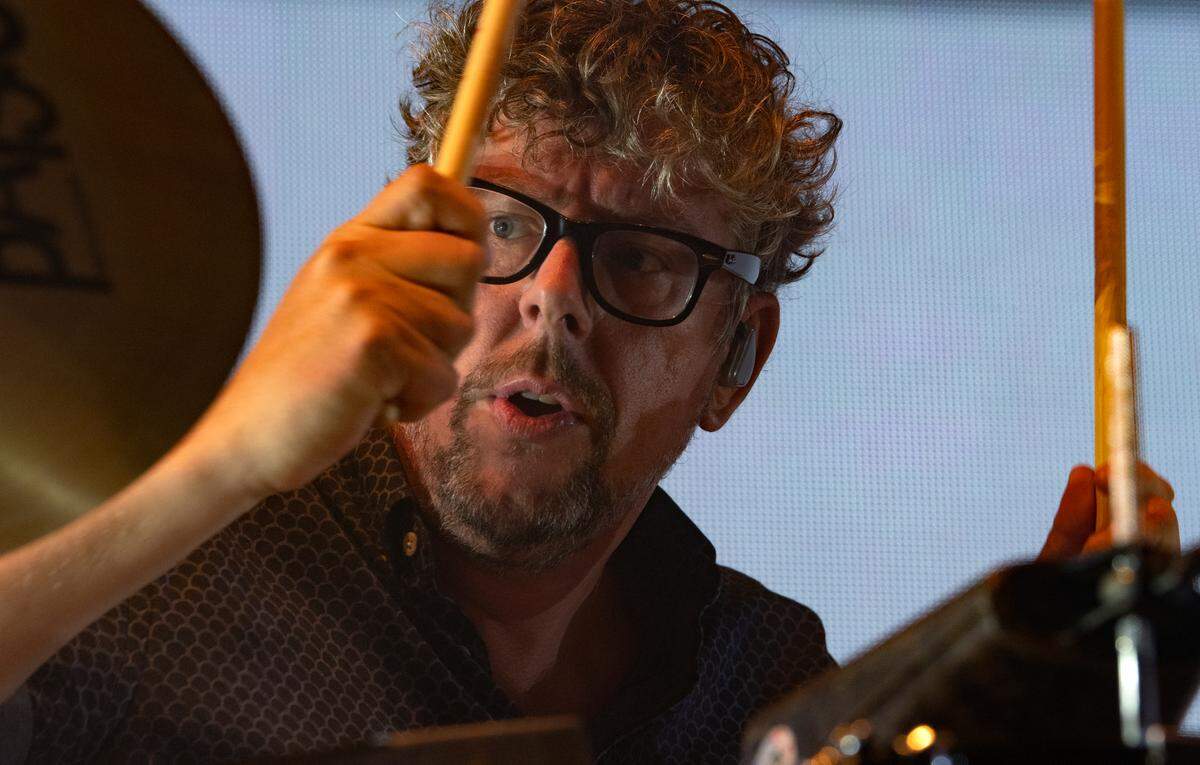 Patrick Carney pounds the drums for The Black Keys in concert at Raleigh, N.C.’s Coastal Credit Union Music Park at Walnut Creek, Thursday night, Sept. 1, 2022.