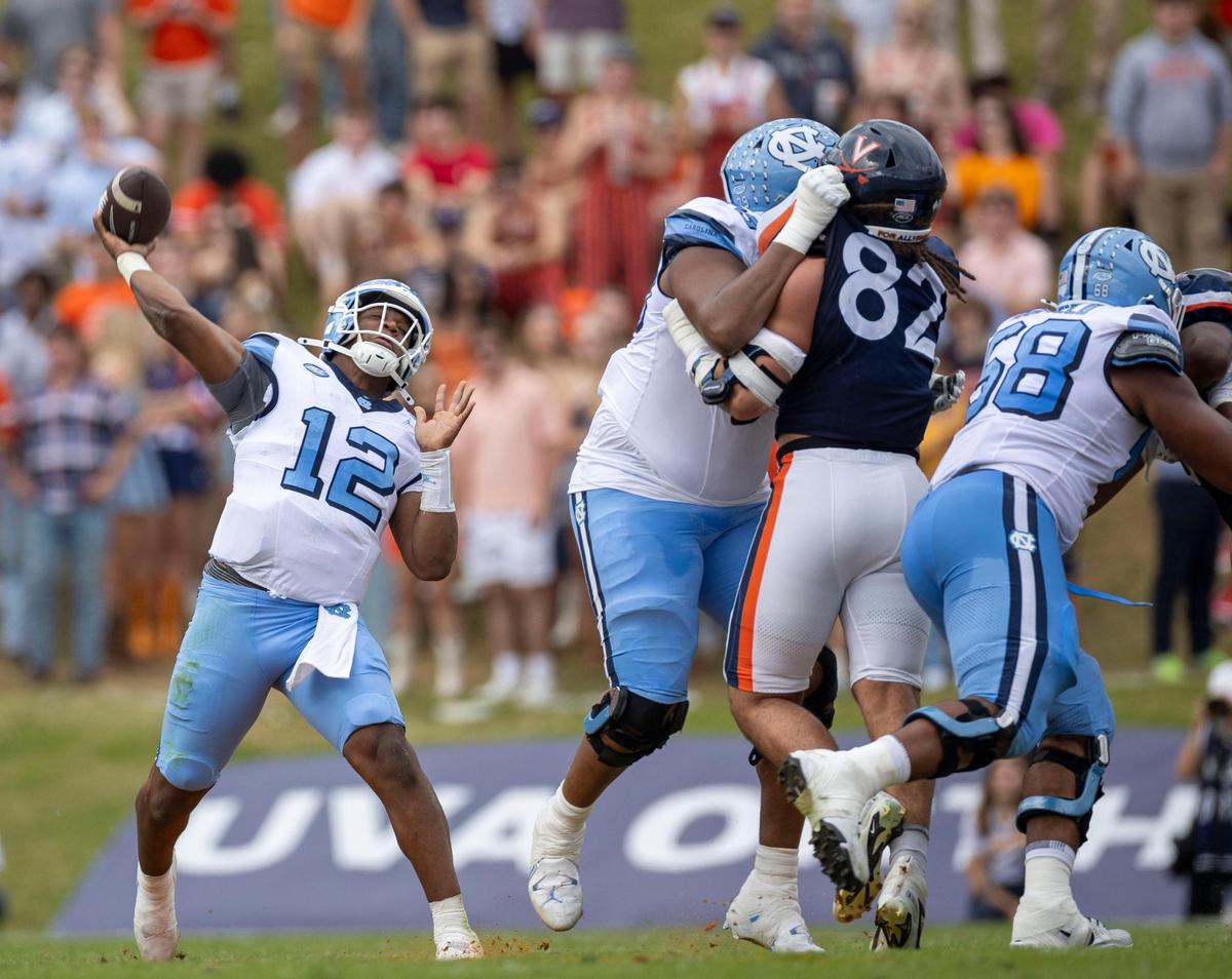 North Carolina quarterback Jacolby Criswell (12) winds up for a long throw to wide receiver J.J. Jones (5) in the first quarter against Virginia on Saturday, October 26, 2024 at Scott Stadium in Charlottesville, Va.