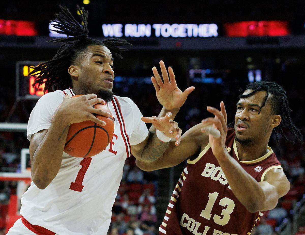 N.C. State’s Jayden Taylor drives past Boston College’s Donald Hand Jr. during the first half of the Wolfpack’s 81-70 win on Saturday, Feb. 24, 2024, at PNC Arena in Raleigh, N.C.