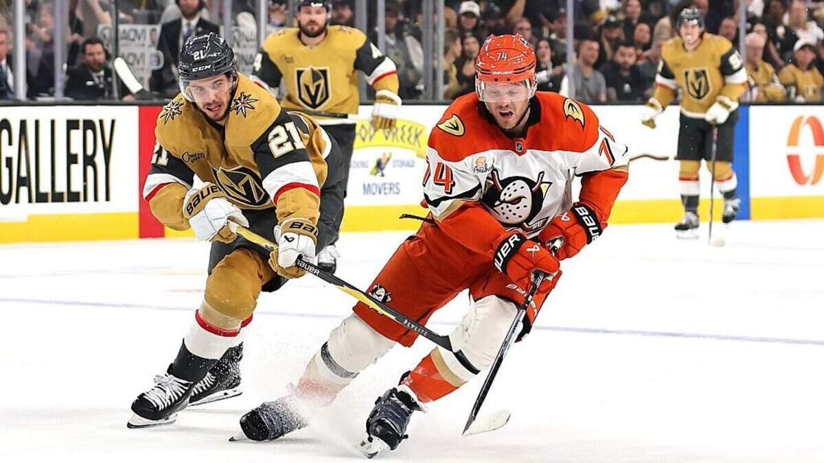 LAS VEGAS, NEVADA - MAY 12: John Carlson #74 of the Anaheim Ducks skates with the puck against Brett Howden #21 of the Vegas Golden Knights in the second period of Game Five of the Second Round of the 2026 Stanley Cup Playoffs at T-Mobile Arena on May 12, 2026 in Las Vegas, Nevada. (Photo by Ethan Miller/Getty Images)