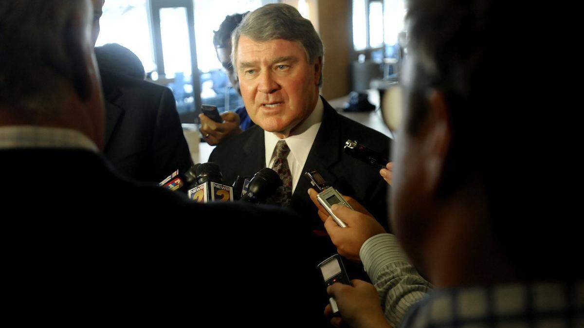 The Atlantic Coast Conference Commissioner John Swofford is swarmed by media after a press conference, Sept. 12, 2012, after announcing that the Atlantic Coast Conference Council of Presidents had unanimously voted to accept the University of Notre Dame as a new member.