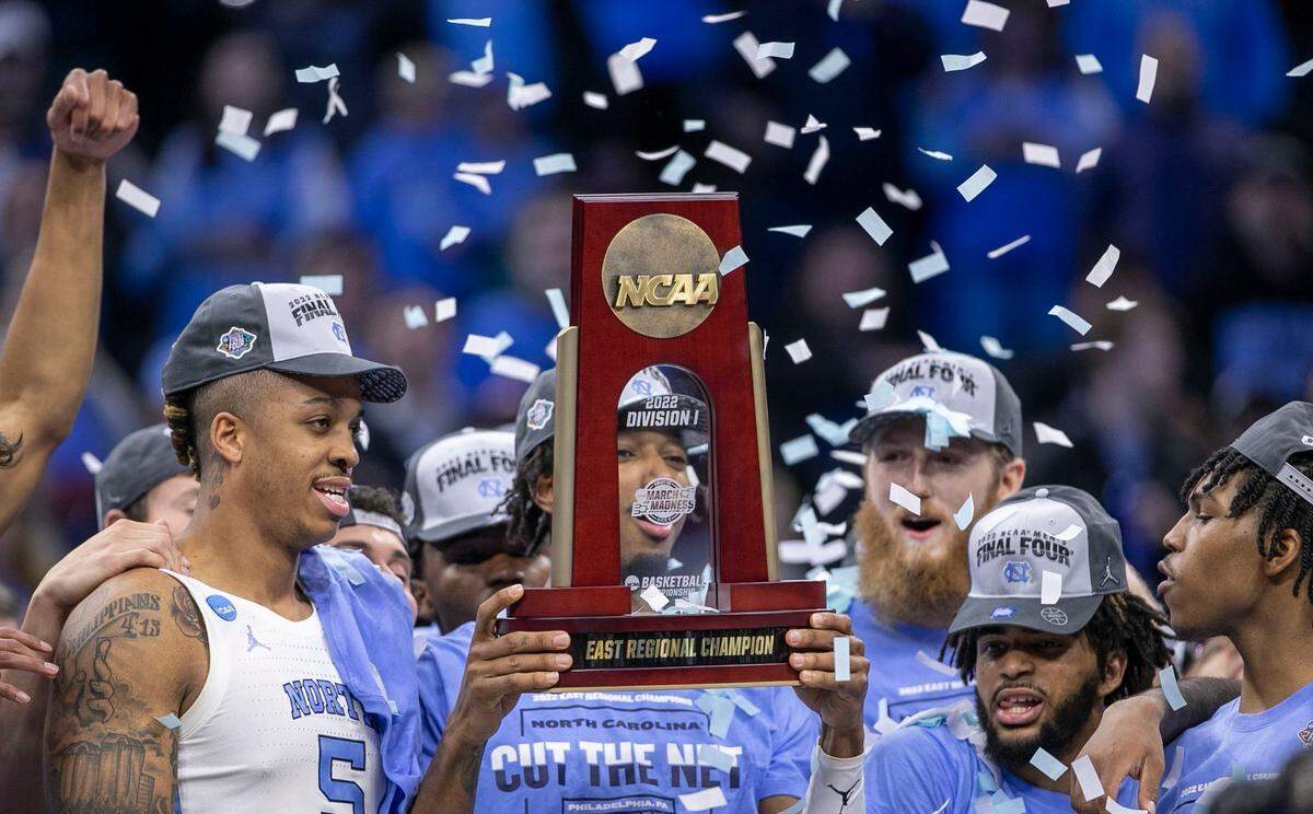 North Carolinas Leaky Black (1) and his teammates celebrate their 69-49 victory over Saint Peters with the NCAA East Regional trophy final on Sunday, March 27, 2022 at Wells Fargo Center in Philadelphia, Pa.