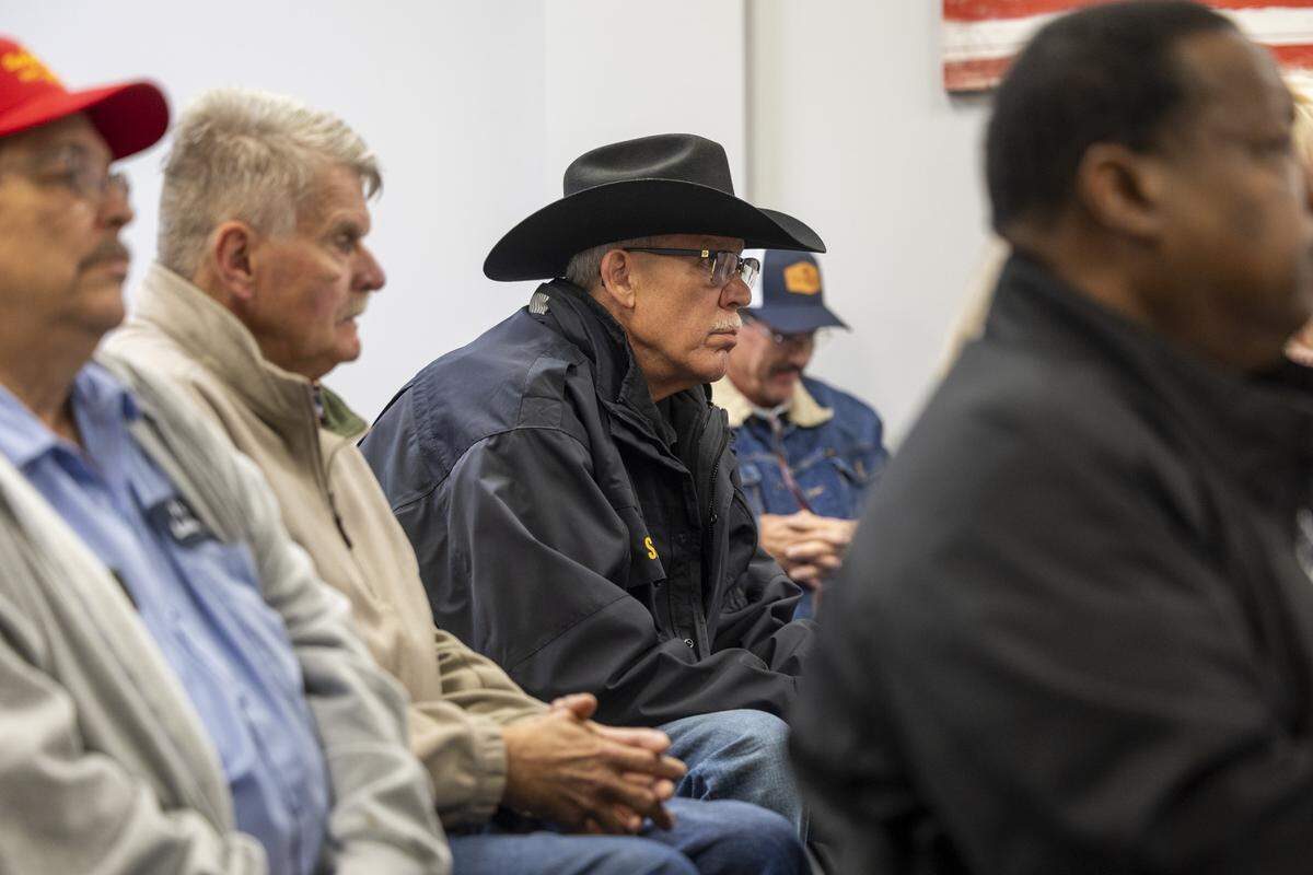 Rockingham County Sheriff Sam Page, center, watches as a bipartisan team with the Rockingham County Board of Elections hand-counts a sample of ballots Tuesday, March 24, 2026, at the board office in Reidsville in the Republican primary between Senate leader Phil Berger and Page. 
