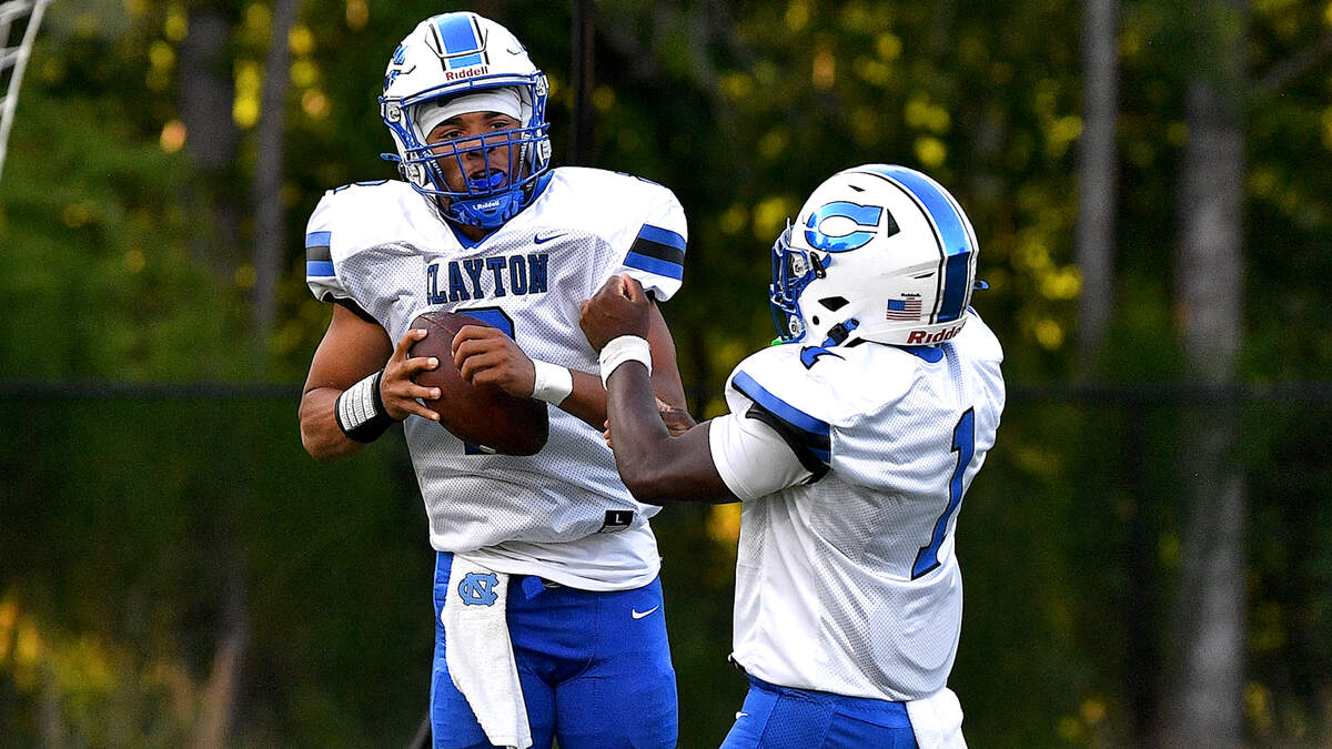Clayton quarterback Aiden Smalls (2) celebrates the touchdown in the end zone with running back Noah Smith (1) during the first half. The Wake Forest Cougars and the Clayton Comets met in a non-conference football game in Wake Forest, N.C. on August 23, 2024.