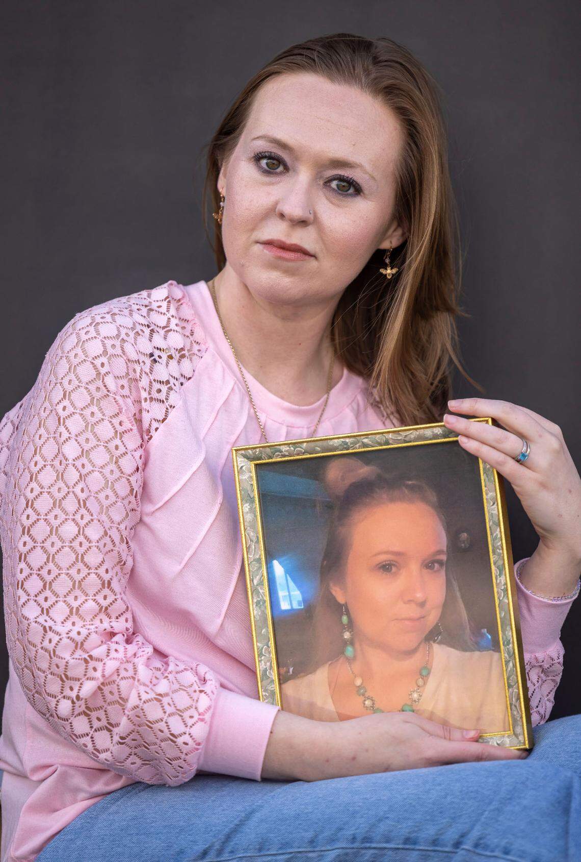 Kelly White holds a portrait of her cousin, Alena Ayers. She is among those still missing six months after remnants of Hurricane Helene brought historic flooding to the North Toe River and to Relief, a small community in Mitchell County.