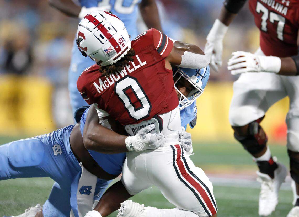 North Carolina linebacker Kaimon Rucker (25) hits South Carolina running back Juju McDowell (0) for a loss during the second half of UNC’s 31-17 victory over South Carolina in the Duke’s Mayo Classic at Bank of America Stadium in Charlotte, N.C., Saturday, Sept. 2, 2023.