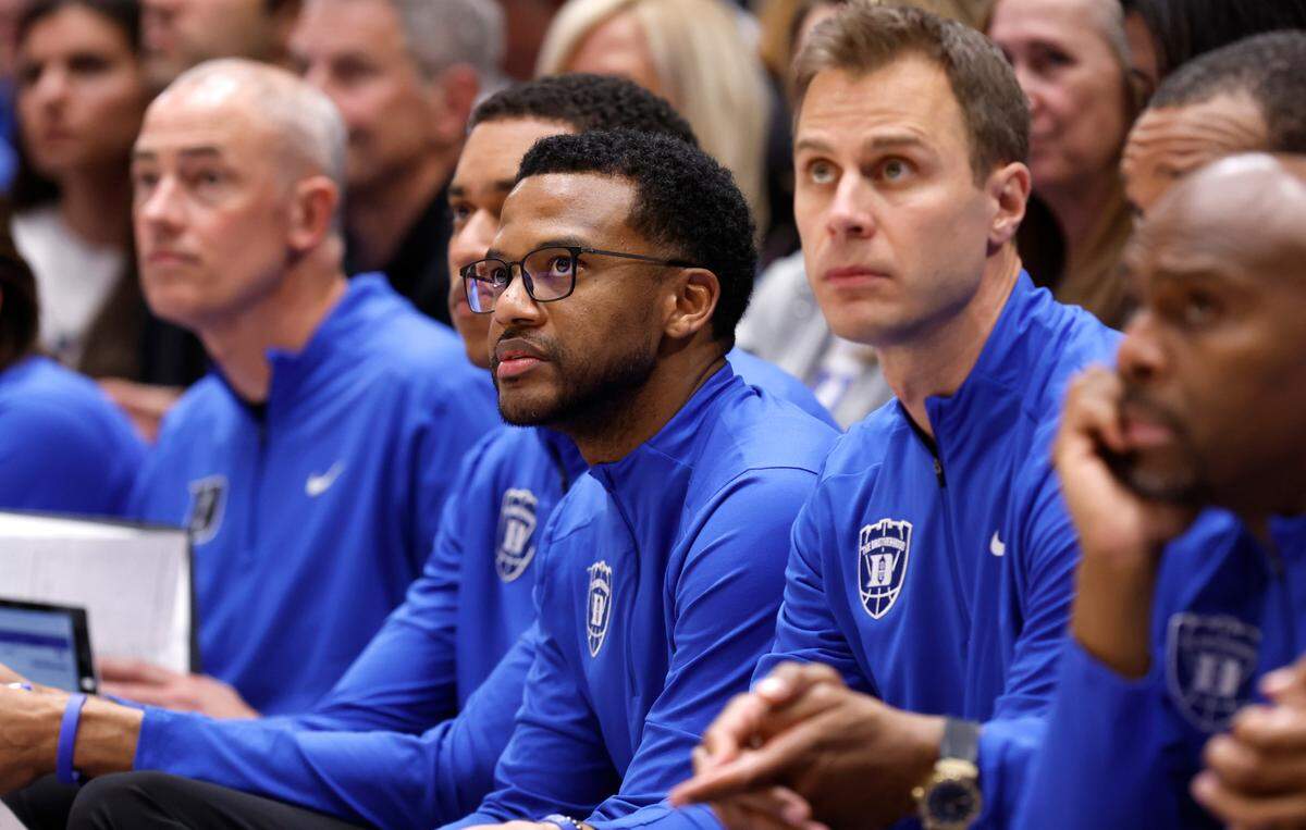 Duke associate head coach Jai Lucas watches during the second half of Duke’s 100-65 victory over Florida State at Cameron Indoor Stadium in Durham, N.C., Saturday, March 1, 2025. To his right is head coach Jon Scheyer.