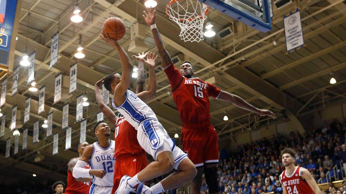 N.C. State’s Manny Bates (15) gets ready to blocks the shot by Duke’s Cassius Stanley (2) during the Duke Blue Devils’ 88-69 victory over N.C. State at Cameron Indoor Stadium in Durham, N.C., Monday, March 2, 2020.