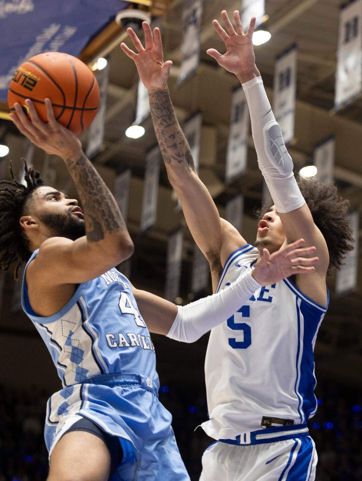 North Carolina’s R.J. Davis (4) drives to the basket against Duke’s Tyrese Proctor (5) in the second half on Saturday, March 9, 2024 at Cameron Indoor Stadium in Durham, N.C.