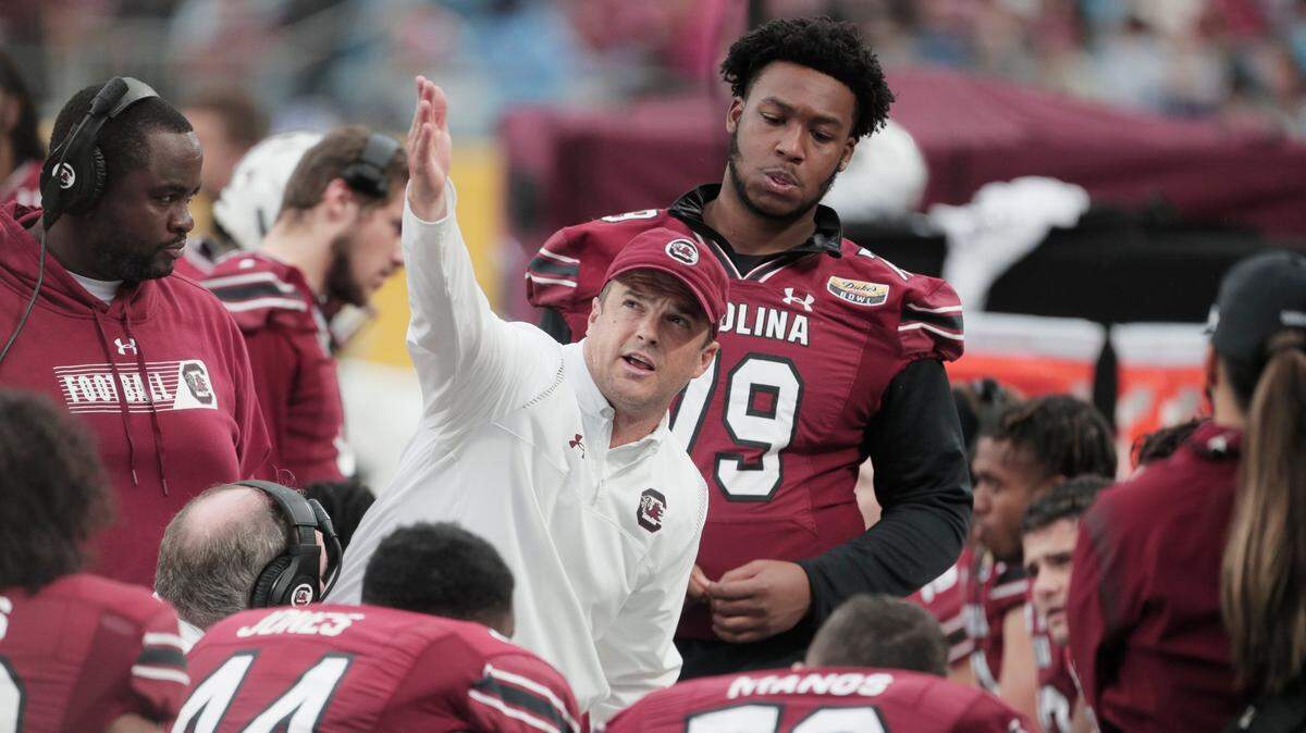 South Carolina Gamecocks head coach Shane Beamer talks to his team as they play North Carolina at the Dukes Mayo Bowl at Bank of America Stadium in Charlotte, North Carolina on Thursday, December 30, 2021.