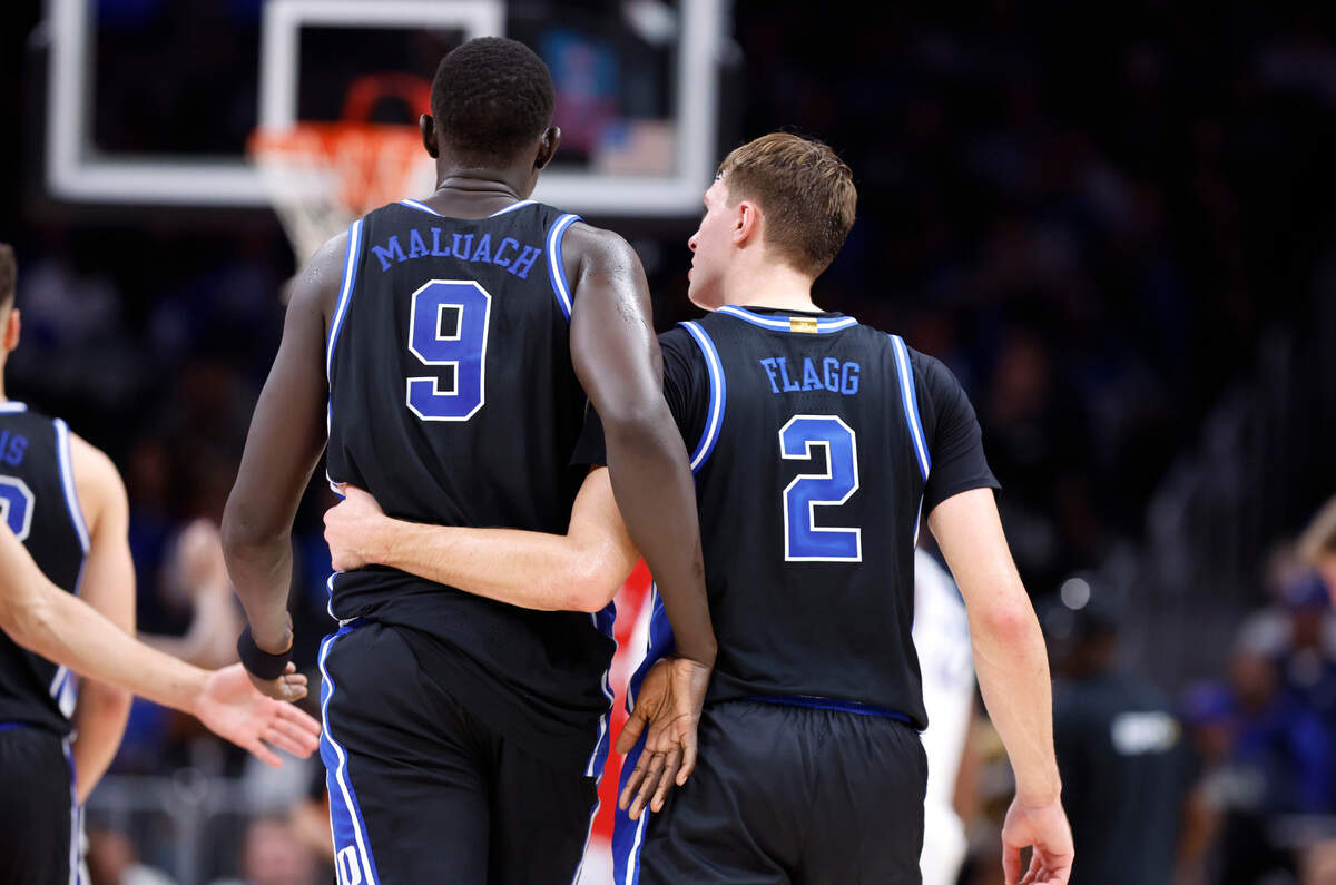 Duke’s Cooper Flagg (2) talks with Khaman Maluach (9) during the second half of Kentucky’s 77-72 victory over Duke in the State Farm Champions Classic in Atlanta, Ga., Tuesday, Nov. 12, 2024.