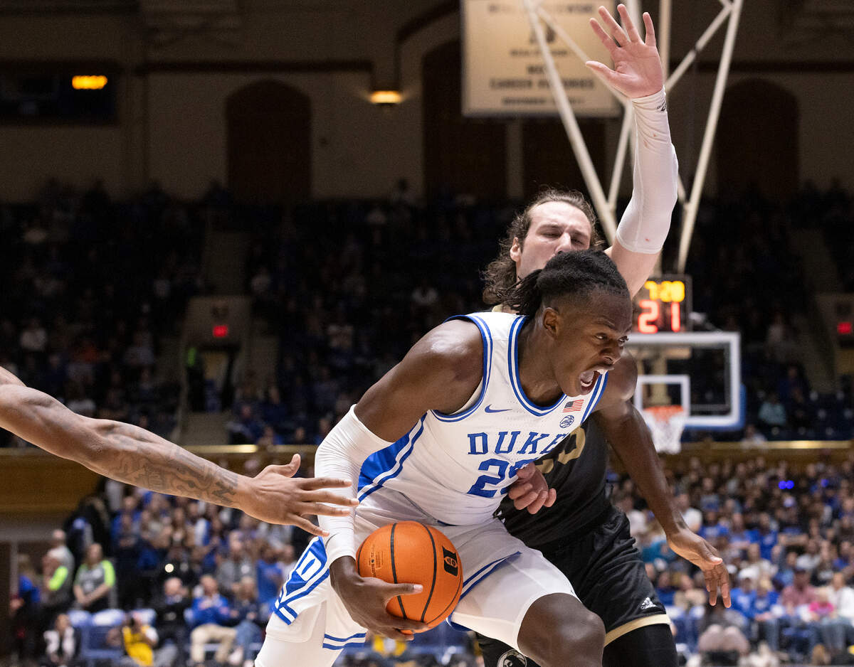 Duke’s Mark Mitchell pushes the ball past UNC Pembroke’s Steven Lassiter during the first half of the Blue Devils’ 109-64 exhibition win on Wednesday, Nov. 1, 2023, at Cameron Indoor Stadium in Durham, N.C.