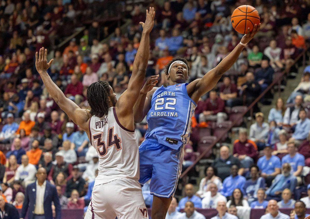 North Carolina forward Ven-Allen Lubin (22) puts up a shot against Virginia Tech’s Mylyjael Poteat (34) in the second half on Tuesday, March 3, 2025 at Cassell Coliseum in Blacksburg, Va.