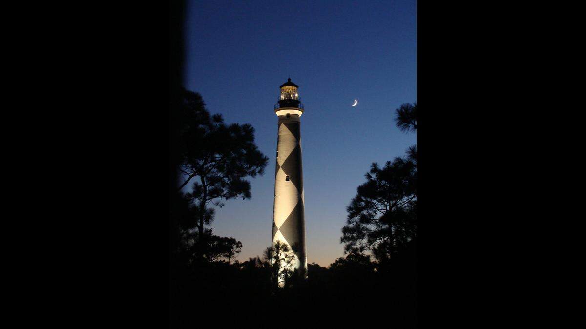 Cape Lookout Lighthouse is 163-feet tall and was built with a light that could be seen by mariners 15 miles out to sea, the National Park Service says.