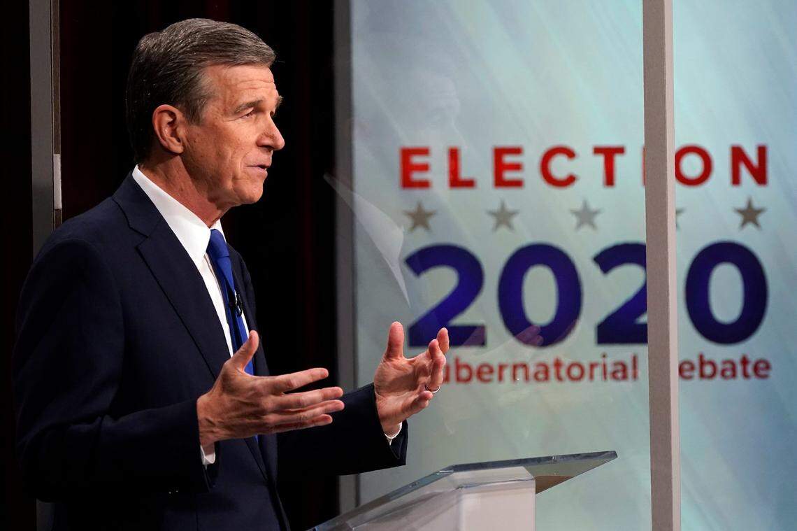 North Carolina Gov. Roy Cooper makes a comment during a live televised debate with Lt. Gov. Dan Forest at UNC-TV studios in Research Triangle Park, N.C., Wednesday, Oct. 14, 2020.