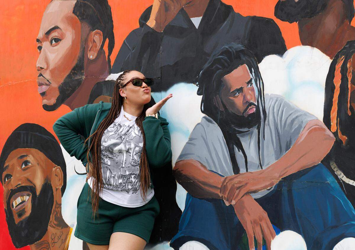 Kiana Dixon of Savannah, Ga. blows J. Cole a kiss while posing with artwork at the fifth Dreamville Festival on Sunday, April 6, 2025, at Dorothea Dix Park in Raleigh, N.C.