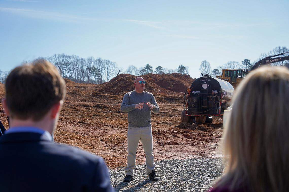 David Coble addresses attendees as construction of the Timber Road extension begins in Mooresville early this year. Coble, a former town commissioner, works for the developer of a residential project that includes the road.