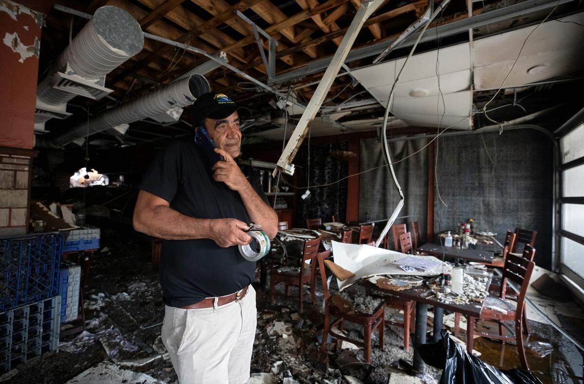Jamil Kadoura, owner of Mediterranean Deli, Bakery and Catering, stands inside the Chapel Hill restaurant on Monday, July 24, 2023, following a Saturday fire in which the building suffered extensive damage.