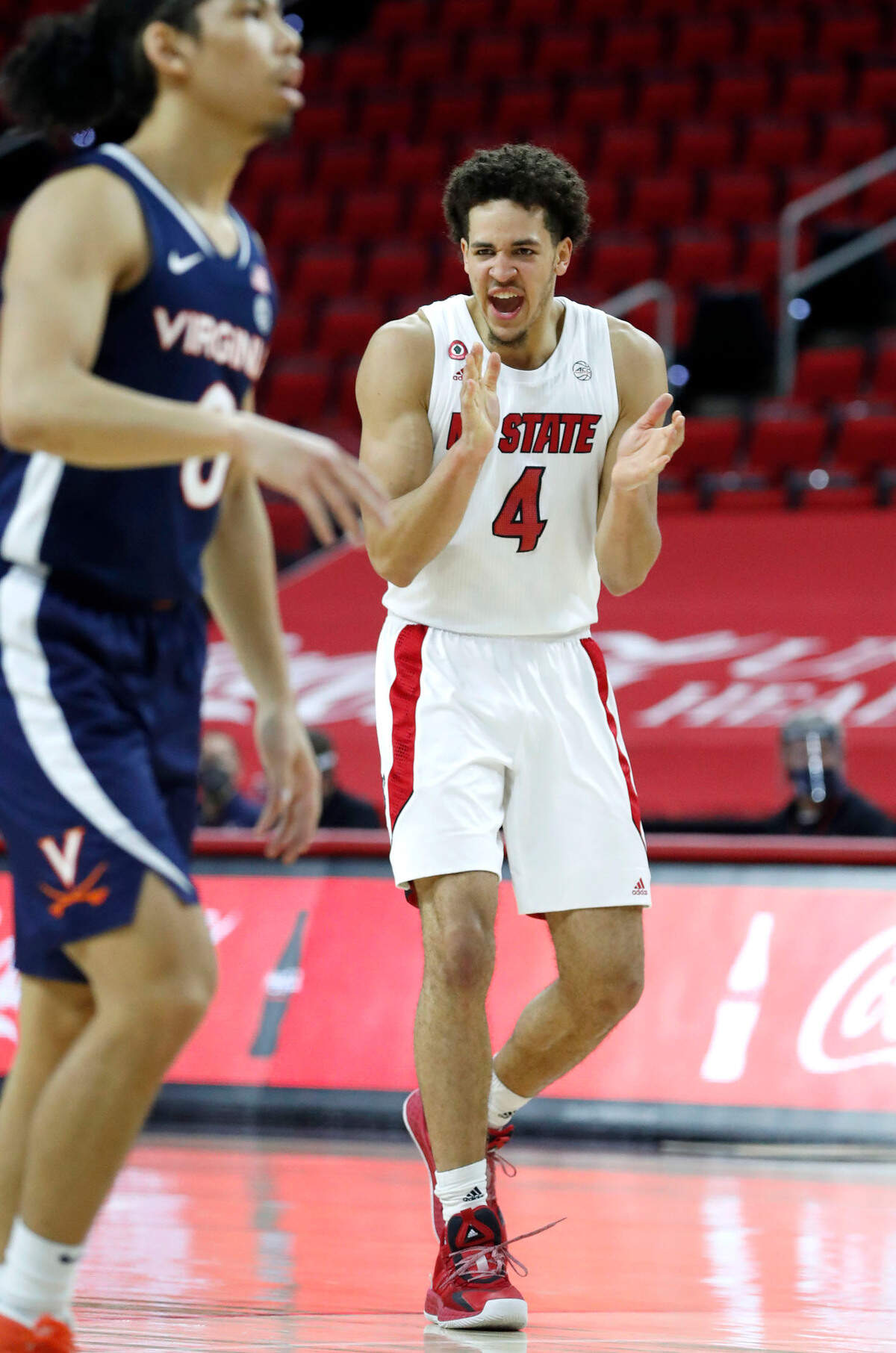 N.C. State’s Jericole Hellems (4) celebrates during the second half of Virginia’s 64-57 victory over N.C. State at PNC Arena in Raleigh, N.C., Wednesday, February 3, 2021.