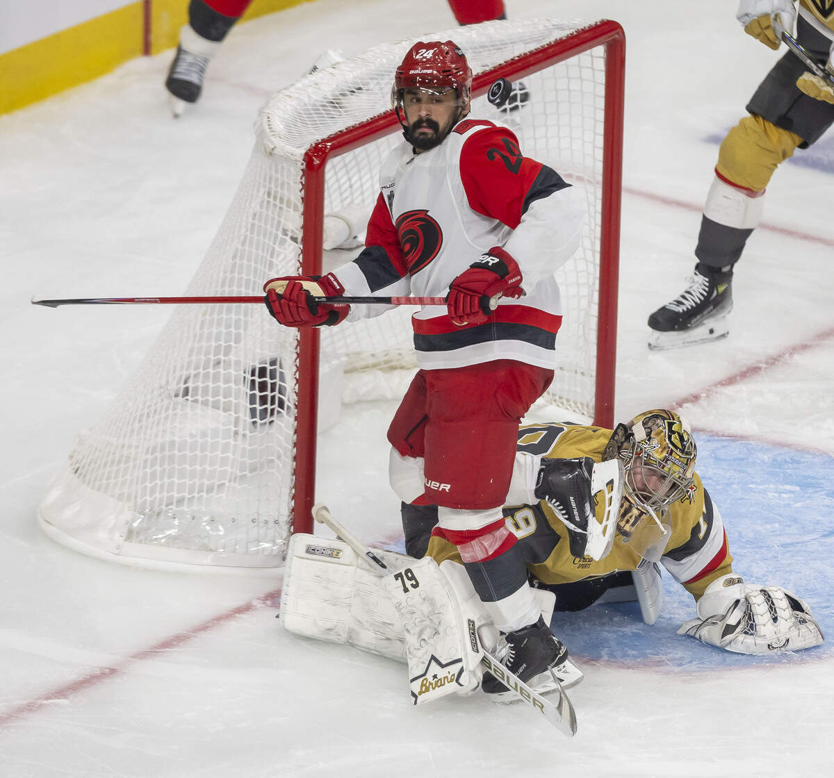 Carolina Hurricanes right wing Seth Jarvis (24) eyes the puck after a deflection by Vegas goalie Carter Hart (79) in the third period of Game 4 of the Stanley Cup Final, on Tuesday, June 9, 2026 in Las Vegas, NV.