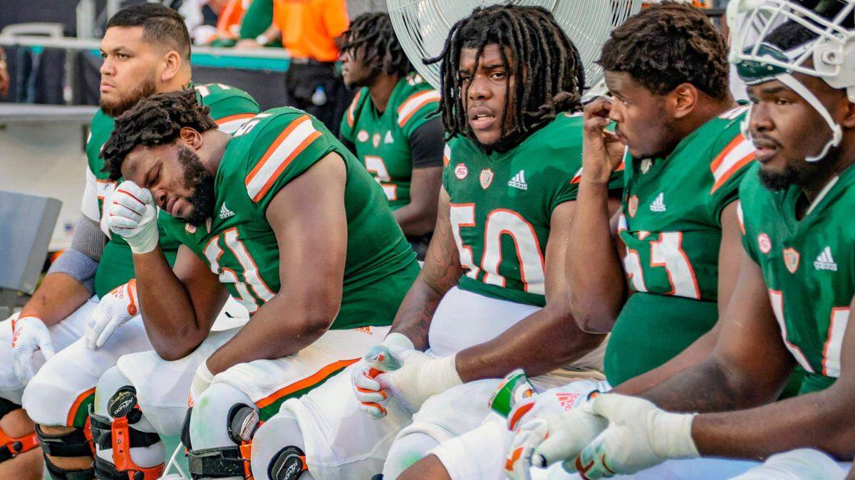 Miami Hurricanes offensive lineman DJ Scaife Jr. (51) sit on the bench as the team trails the Duke Blue Devils late in the fourth quarter at Hard Rock Stadium in Miami Gardens on Saturday, October 22, 2022.