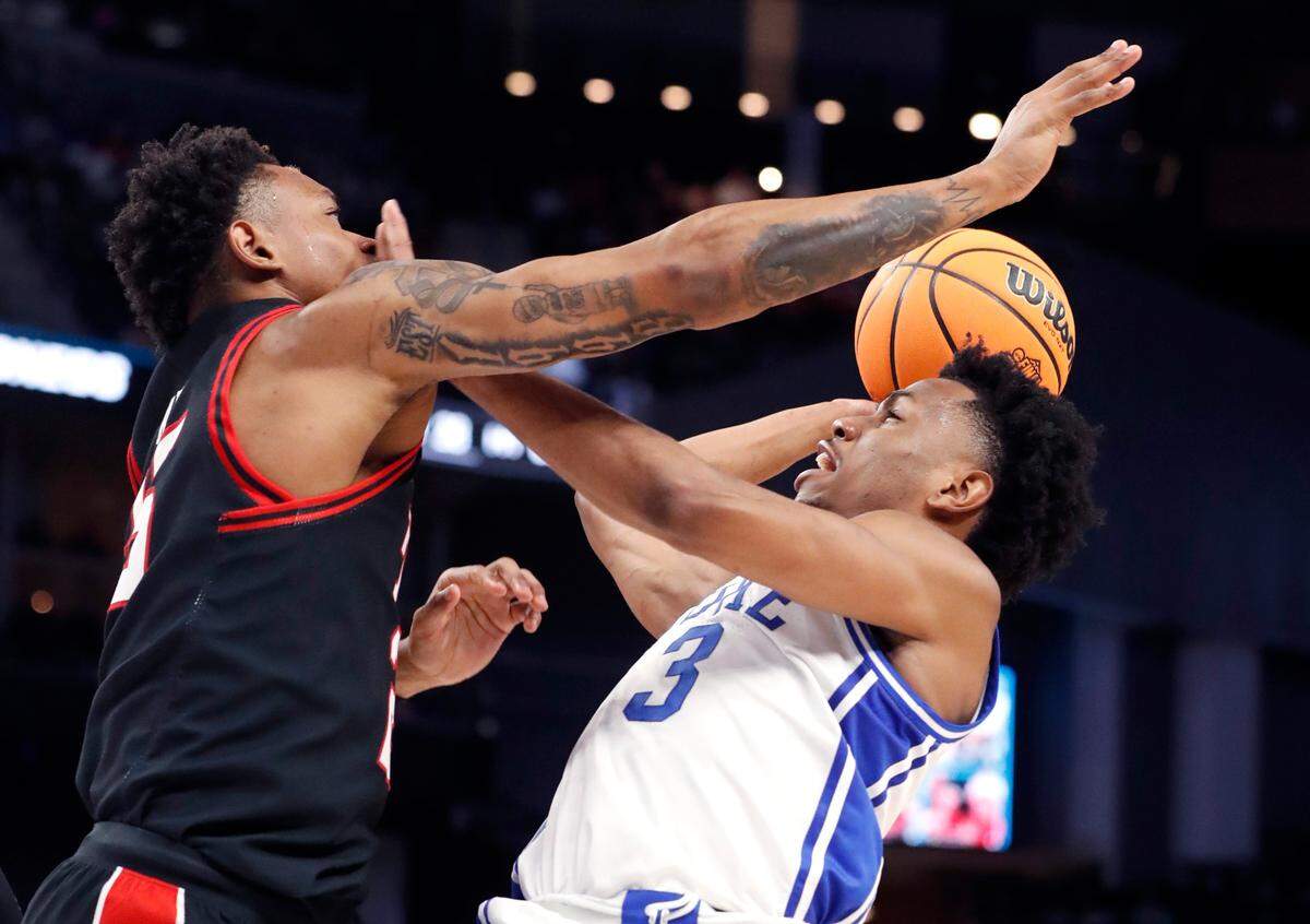 Duke’s Jeremy Roach (3) shoots as Texas Tech’s Adonis Arms (25) defends during the second half of Duke’s 78-73 victory over Texas Tech in the Sweet 16 round of the NCAA Tournament at the Chase Center in San Francisco, Calif., Thursday, March 24, 2022.