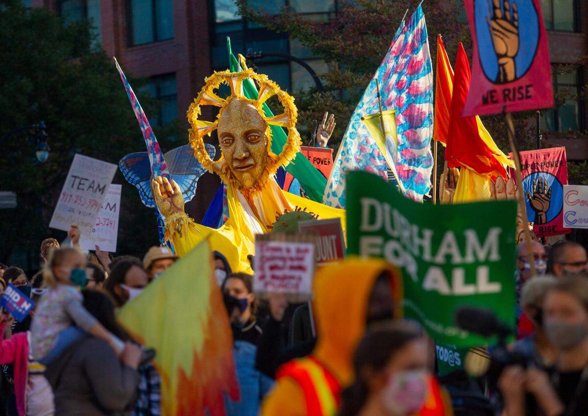 Demonstrators from several community and advocacy groups march n downtown Durham demanding that all votes cast in the recent election be counted on Wednesday, Nov. 4, 2020.
