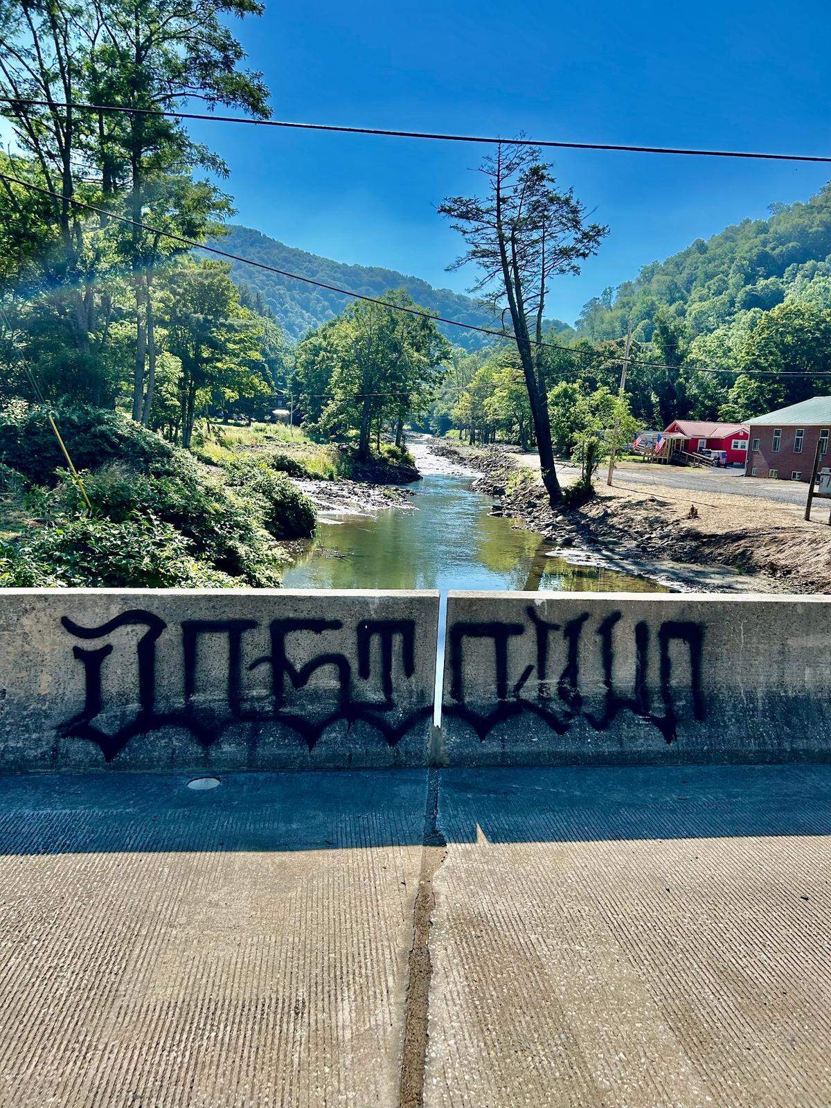 The bridge over the North Toe River in Minneapolis, where Bob and Edwina’s house got lodged after Hurricane Helene. “Dogtown” is the town’s nickname, referring to a time when canines outnumbered humans .
