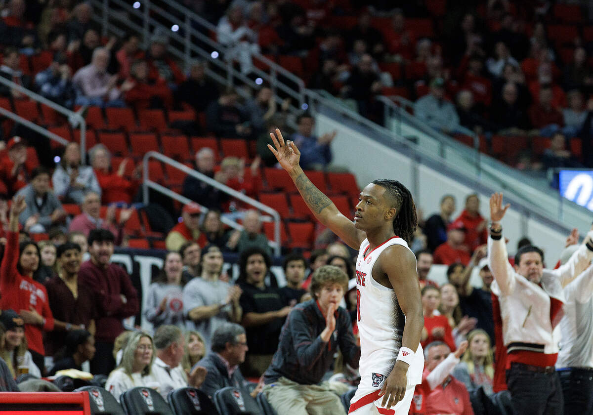 N.C. State’s DJ Horne celebrates after making a three-point basket during the second half of the Wolfpack’s 82-70 win over Saint Louis on Wednesday, Dec. 20, 2023, at PNC Arena in Raleigh, N.C.