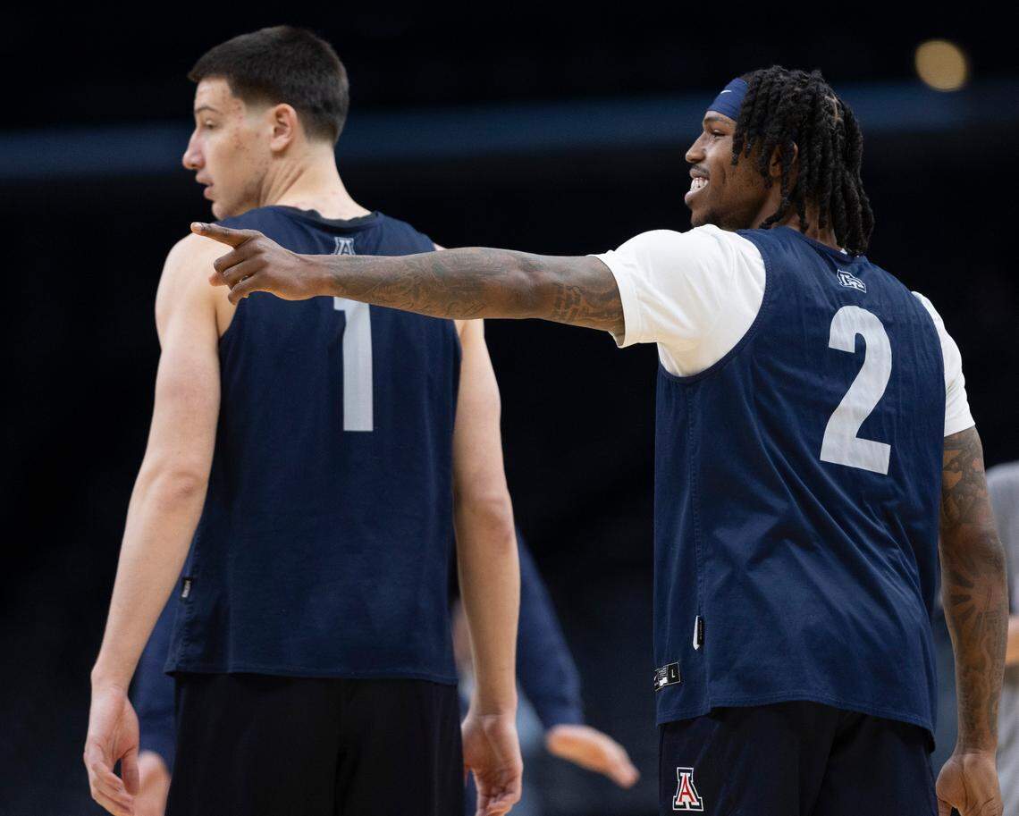 Arizona’s Caleb Love (2) flashes a smile with teammate Filip Borovicanin (1) during the Wildcats’ work out on Wednesday, March 27, 2024 at Crypto.com Arena in Los Angeles, CA.