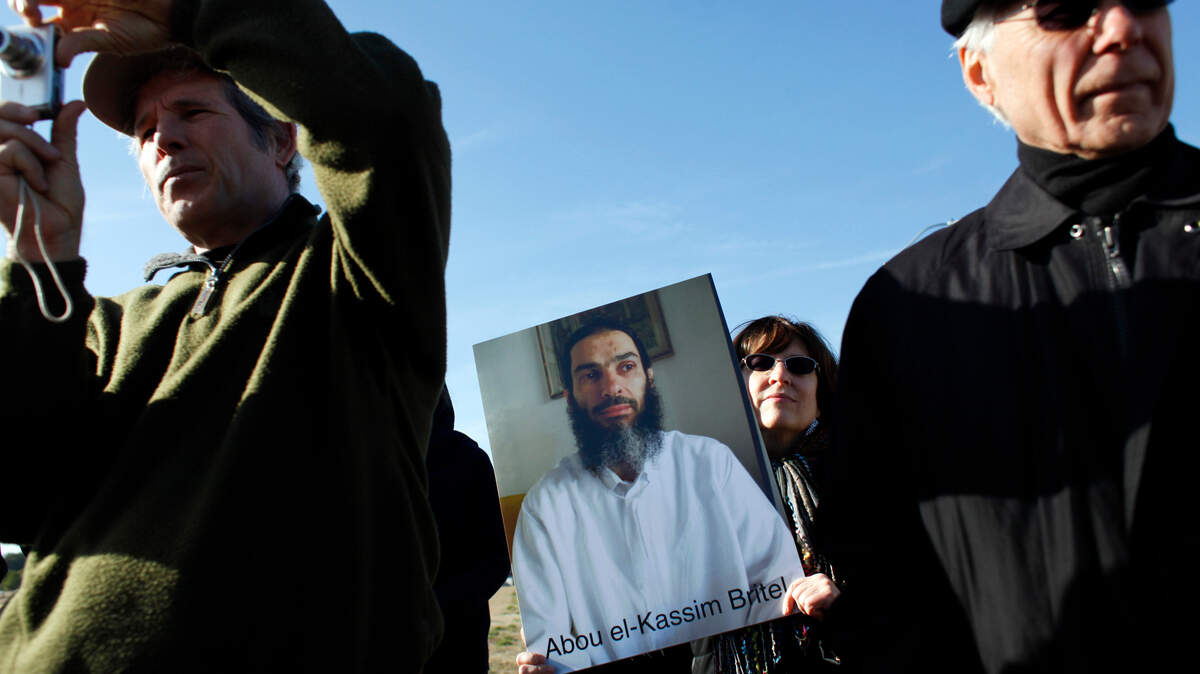 From left, Christian Stalberg, Barbara Zelter and Robert Moore listen during a press conference organized by Stop Torture Now Thursday, January 19, 2012, at the Johnston County airport. Zelter holds a photo of a detainee who is one of the cases detailed in a lengthy report from the UNC law school outlining what a team of lawyers and law students there believe are violations of state and federal laws by the employees of Aero Contractors, Ltd. A new report issued in Sept. 27,  2018 by the  North Carolina Commission of Inquiry on Torture provides more information on the CIA program’s North Carolina connections.