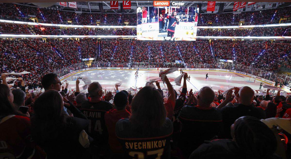 Canes fans cheer as the national anthem is sung before the Hurricanes’ game against the Canadiens in game five of the Eastern Conference Finals at the Lenovo Center Friday, May 29, 2026.