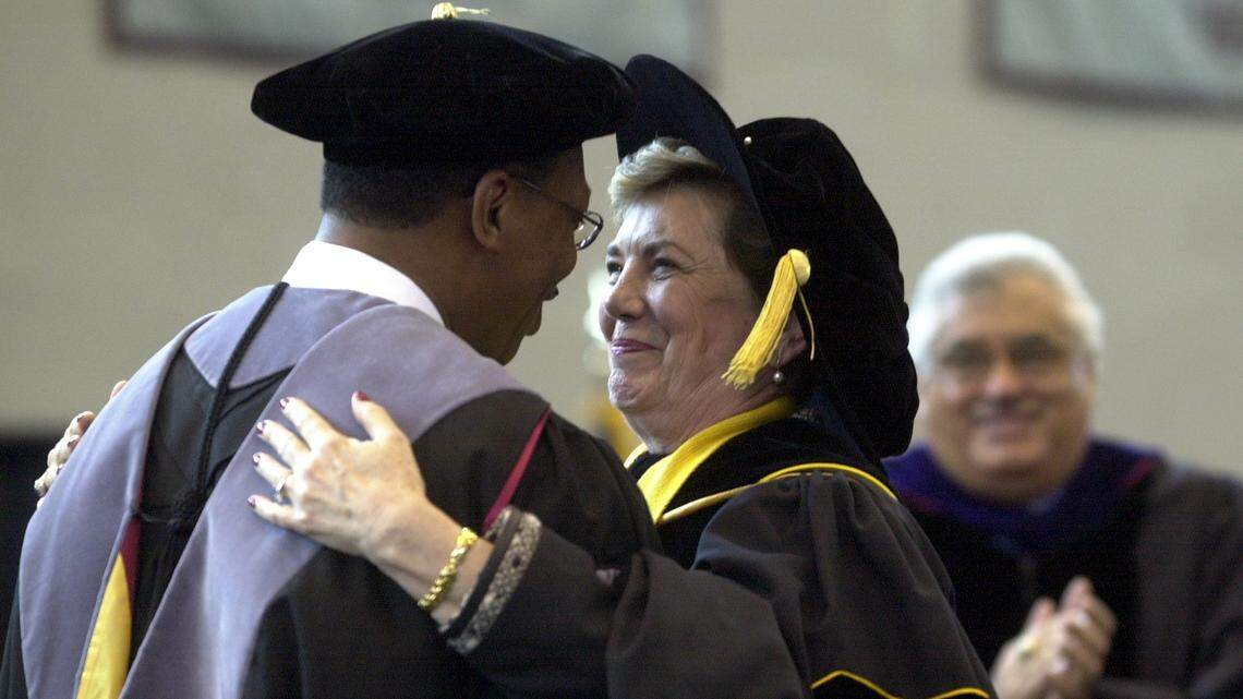 NCCU Chancellor James Ammons, left, is embraced by UNC system president Molly Broad during a ceremony in 2002.