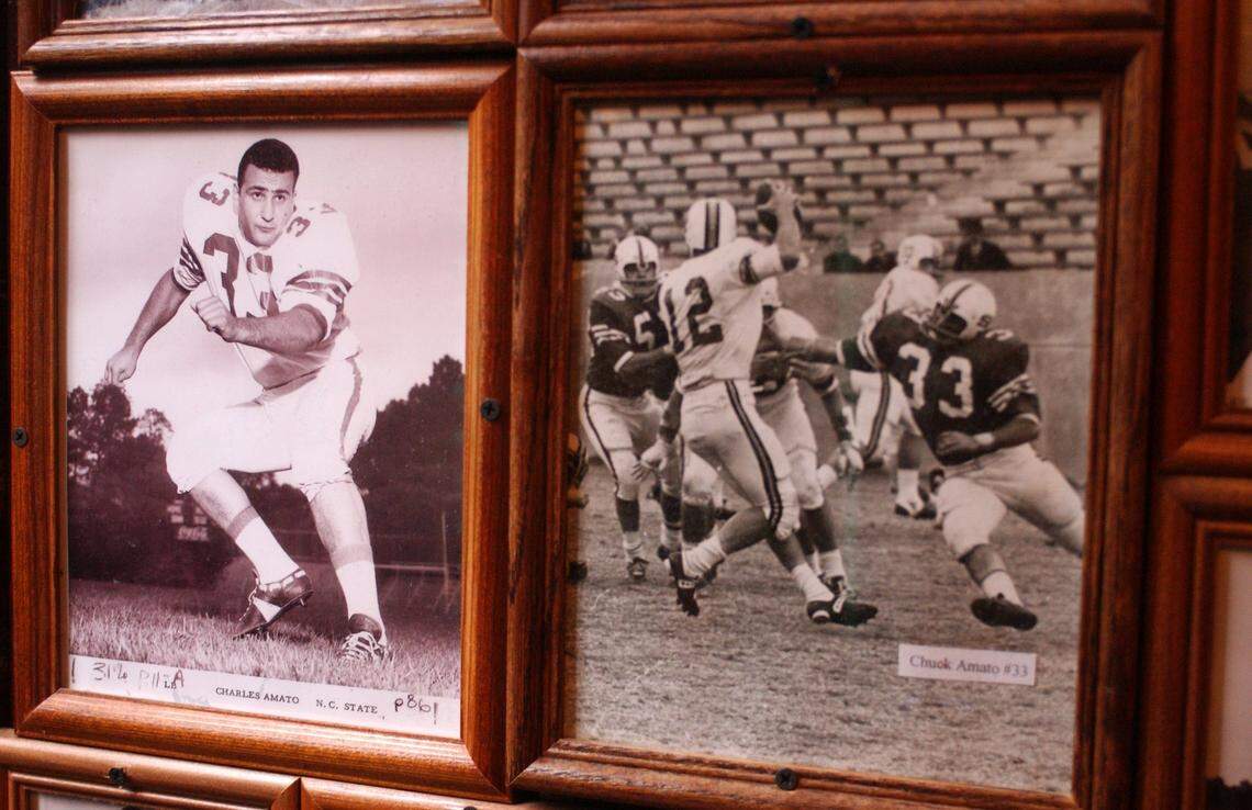 Historic photographs of Chuck Amato from his playing days at N.C. State University decorate the walls at Amedeo’s Italian Restaurant in this file photo from 2003.