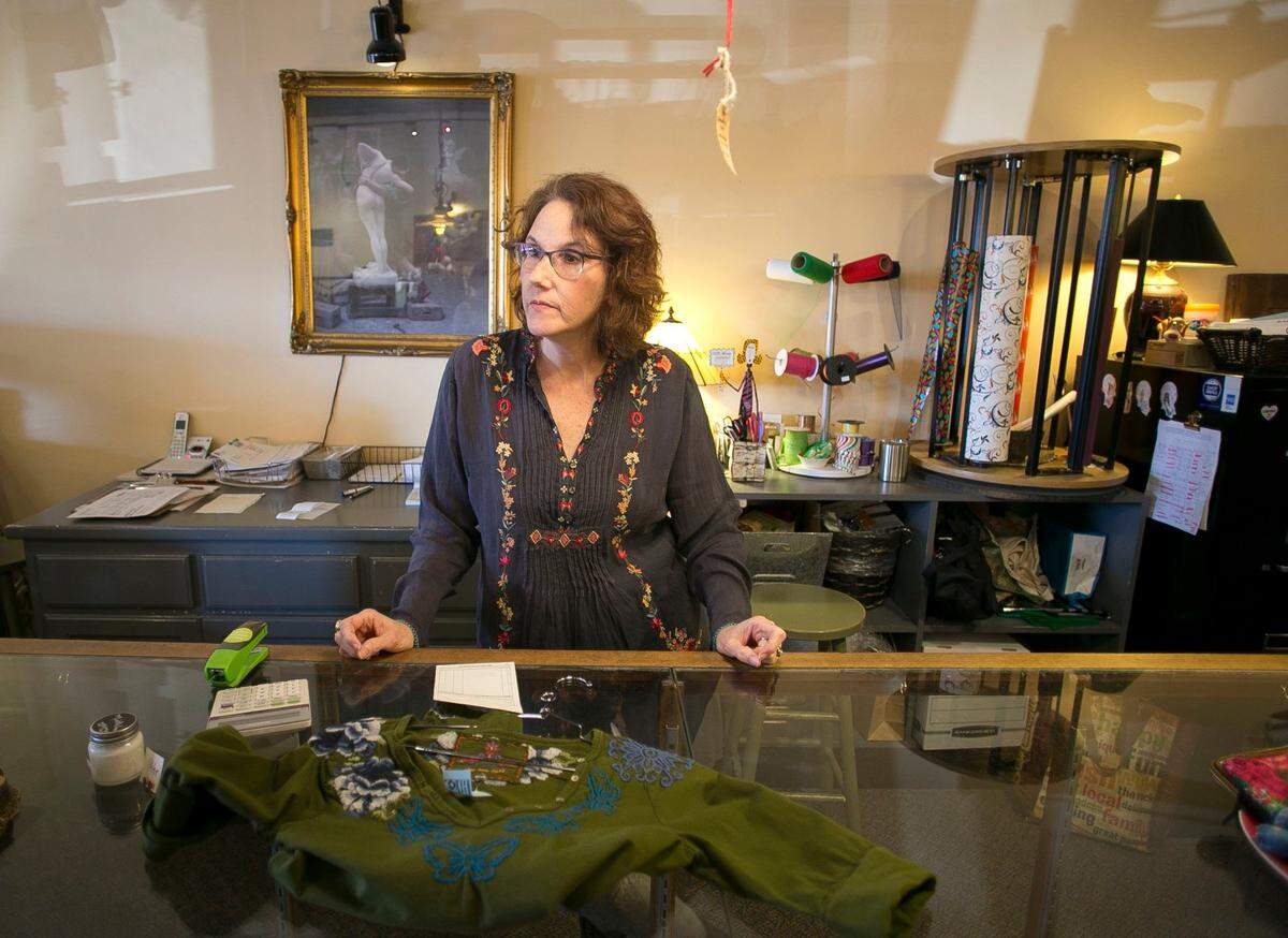 Galatea Boutique owner Cheryl Fraser helps a customer in 2016. The boutique specializes in supporting and carrying locally made, handmade, woman made, fair trade, organic and green clothing, jewelry, gifts, shoes.