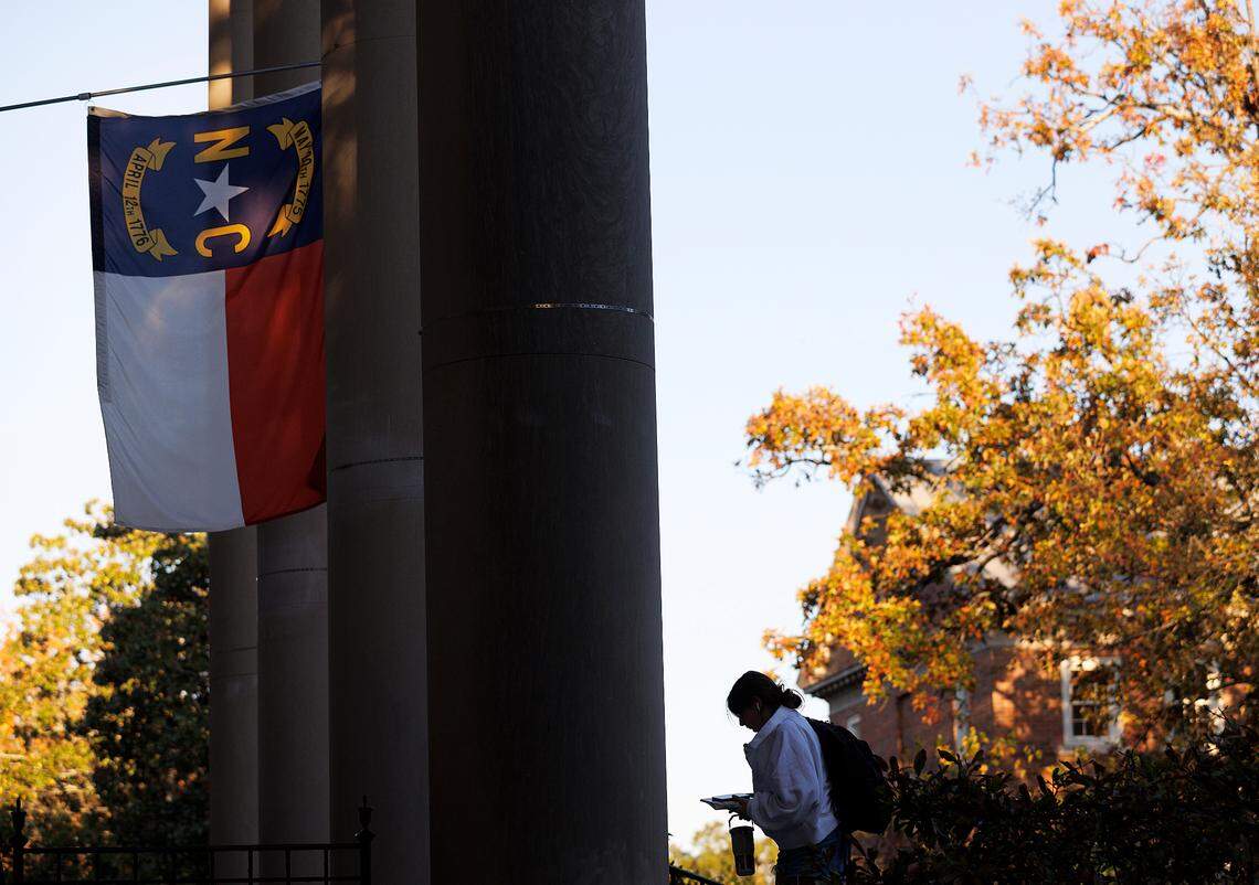 A North Carolina flag flies above South Building on the campus of UNC-Chapel Hill on Monday, Oct. 30, 2023.