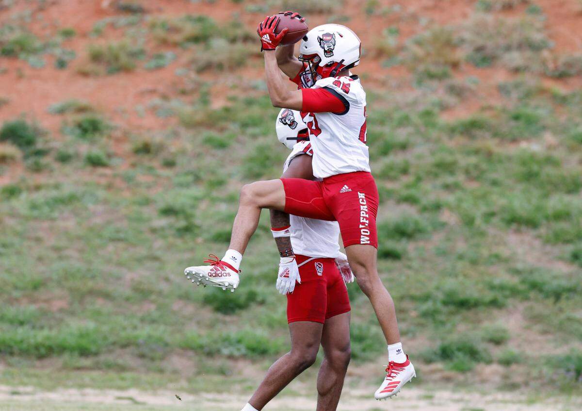 N.C. State cornerback Brandon Cisse (25) makes the catch during the Wolfpack’s first spring practice in Raleigh, N.C., Wednesday, March 1, 2023.