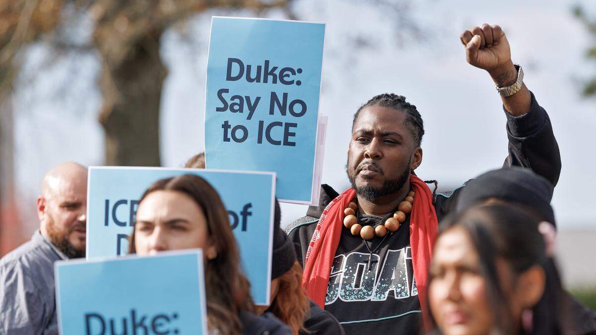 Keith Bullard, representing the Union of Southern Service Workers, holds a sign during a press conference on Wednesday, Nov. 19, 2025, in Durham, N.C. held by community groups to address the response to federal immigration agents in the Triangle.