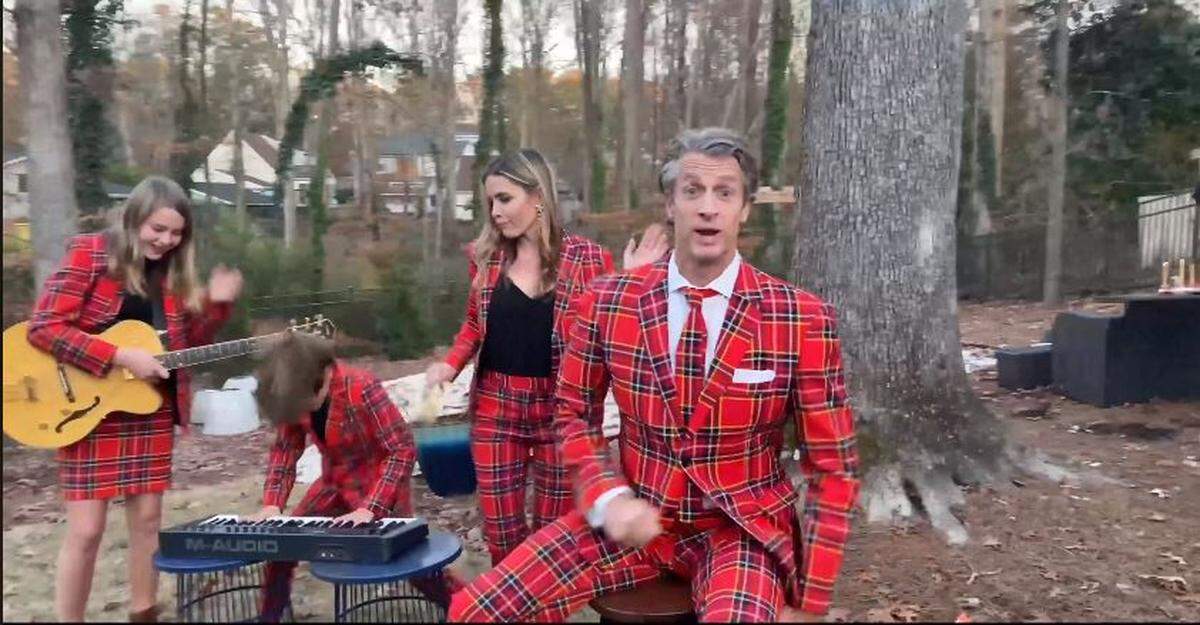 The Holderness Family of Raleigh in the music video “Christmas Jammies 2019 - Raise Your Glass P!nk Parody.’ Pictured L-R: Lola Holderness, Penn Charles Holderness, Kim Holderness and Penn Holderness.