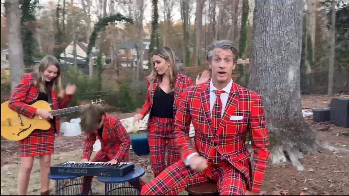 The Holderness Family of Raleigh in the music video “Christmas Jammies 2019 - Raise Your Glass P!nk Parody.’ Pictured L-R: Lola Holderness, Penn Charles Holderness, Kim Holderness and Penn Holderness.