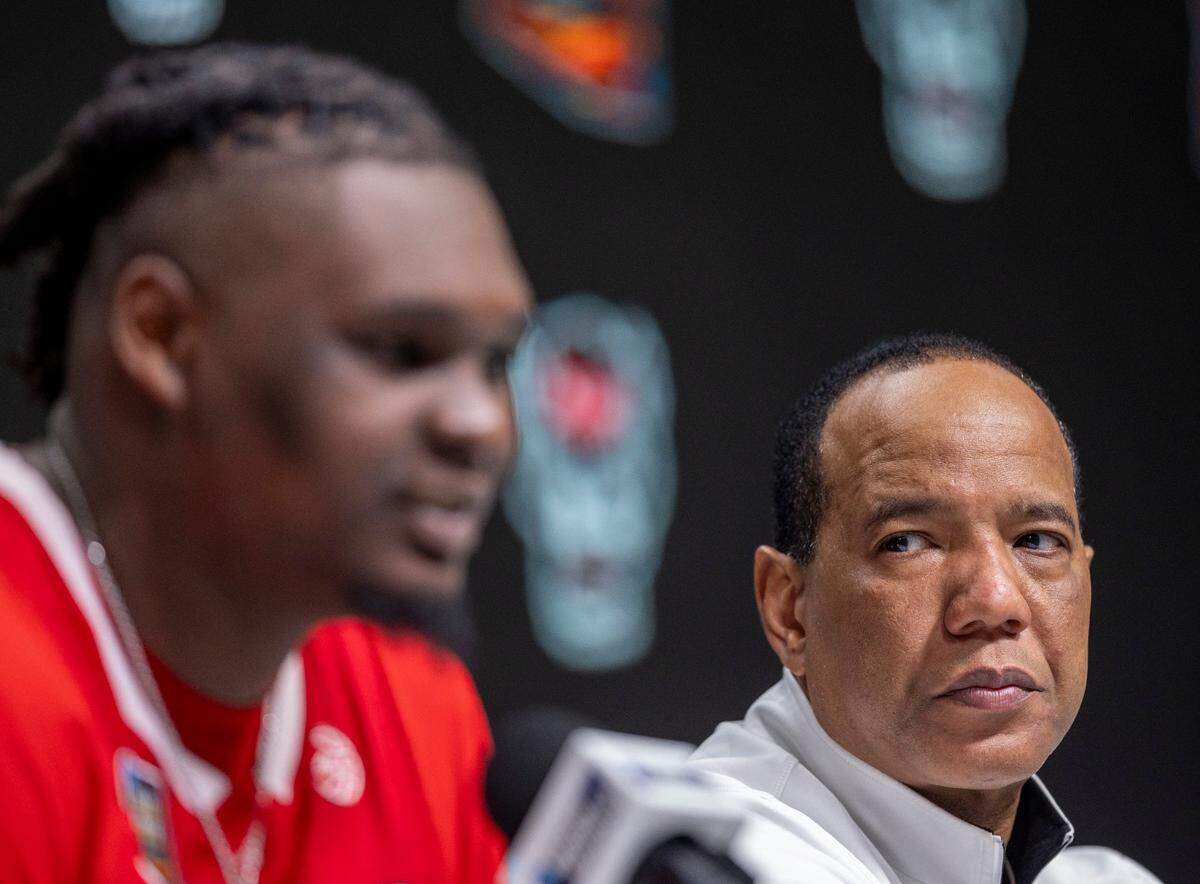 N.C. State coach Kevin Keatts listens to D.J. Burns Jr. (30) as he answers questions from the media following their loss to Purdue during the NCAA Final Four National Semifinal game on Saturday, April 6, 2024 at State Farm Stadium in Glendale, AZ.