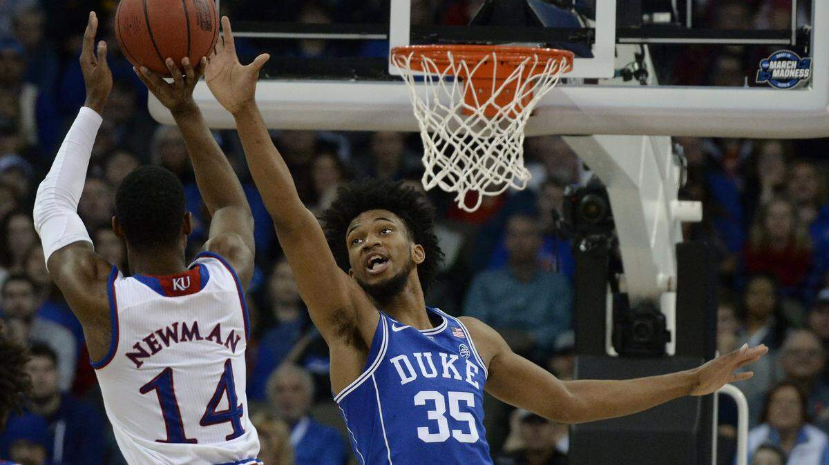 Duke forward Marvin Bagley III (35) contests a first half shot by Kansas guard Malik Newman (14).